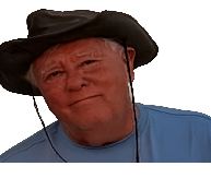 Michael Garrett, an older man wearing a wide-brimmed hat and light blue shirt, smiling gently; background removed for a clean, isolated portrait.